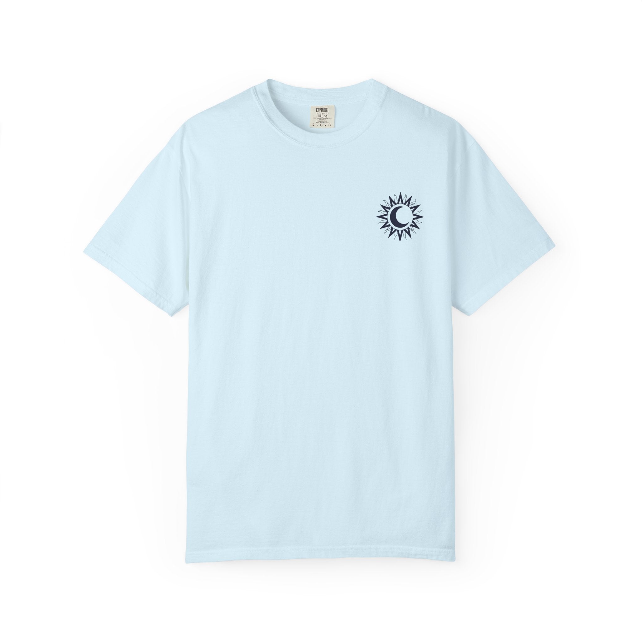A light blue Comfort Colors graphic tee from thtgrlreads featuring a small black sun and crescent moon design inspired by the Kindred's Curse Saga by Penn Cole, available through Printify in the Tees collection.