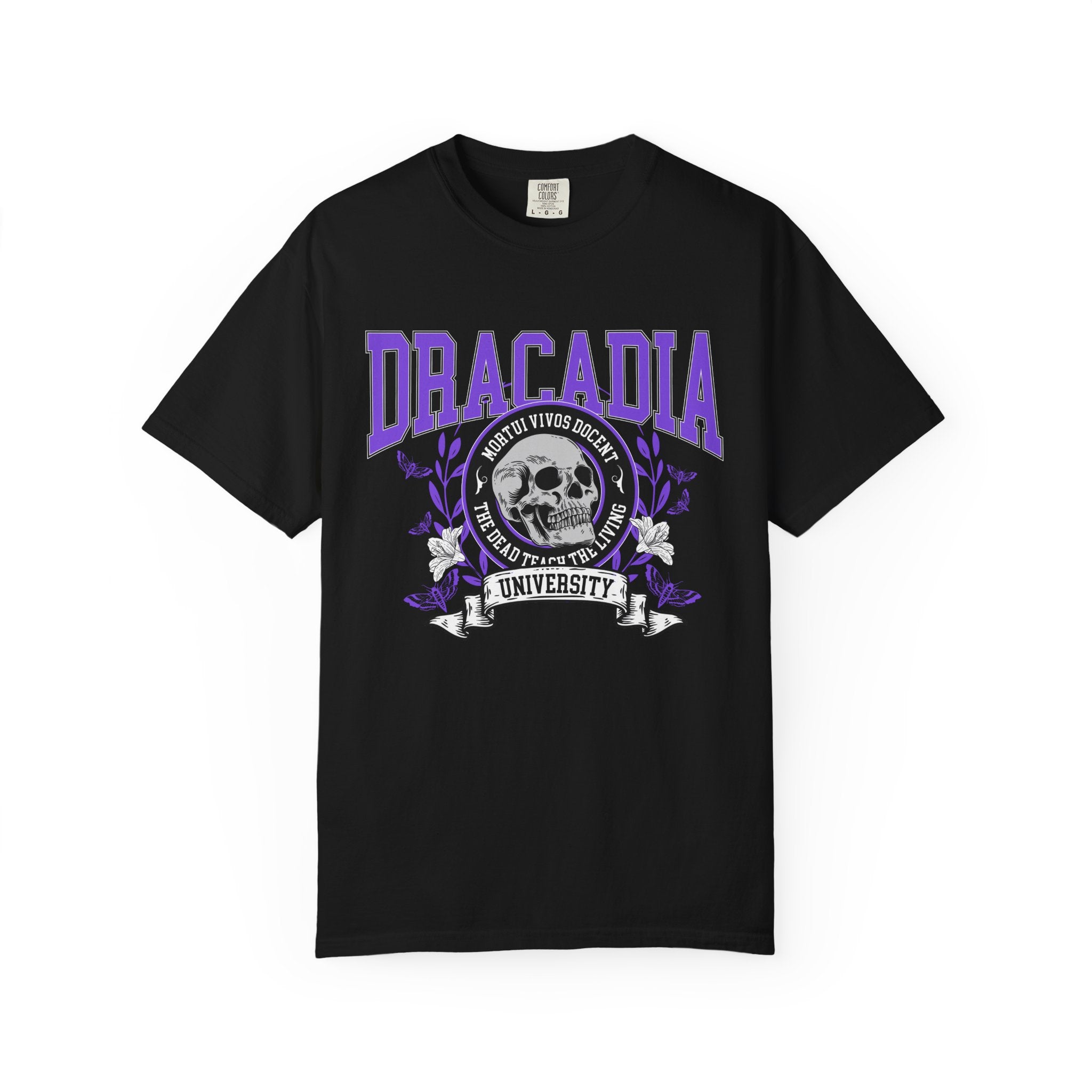 thtgrlreads Nocticadia collection Comfort Colors graphic tee featuring a purple and white vintage puff print of a skull and floral design with "Dracadia University" text on black cotton.